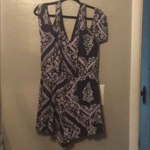 Floral navy blue, white, and hints of red blouse